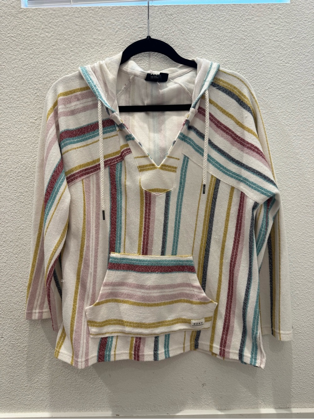 Roxy Wild and Free hooded poncho with multi-colored pastel stripes